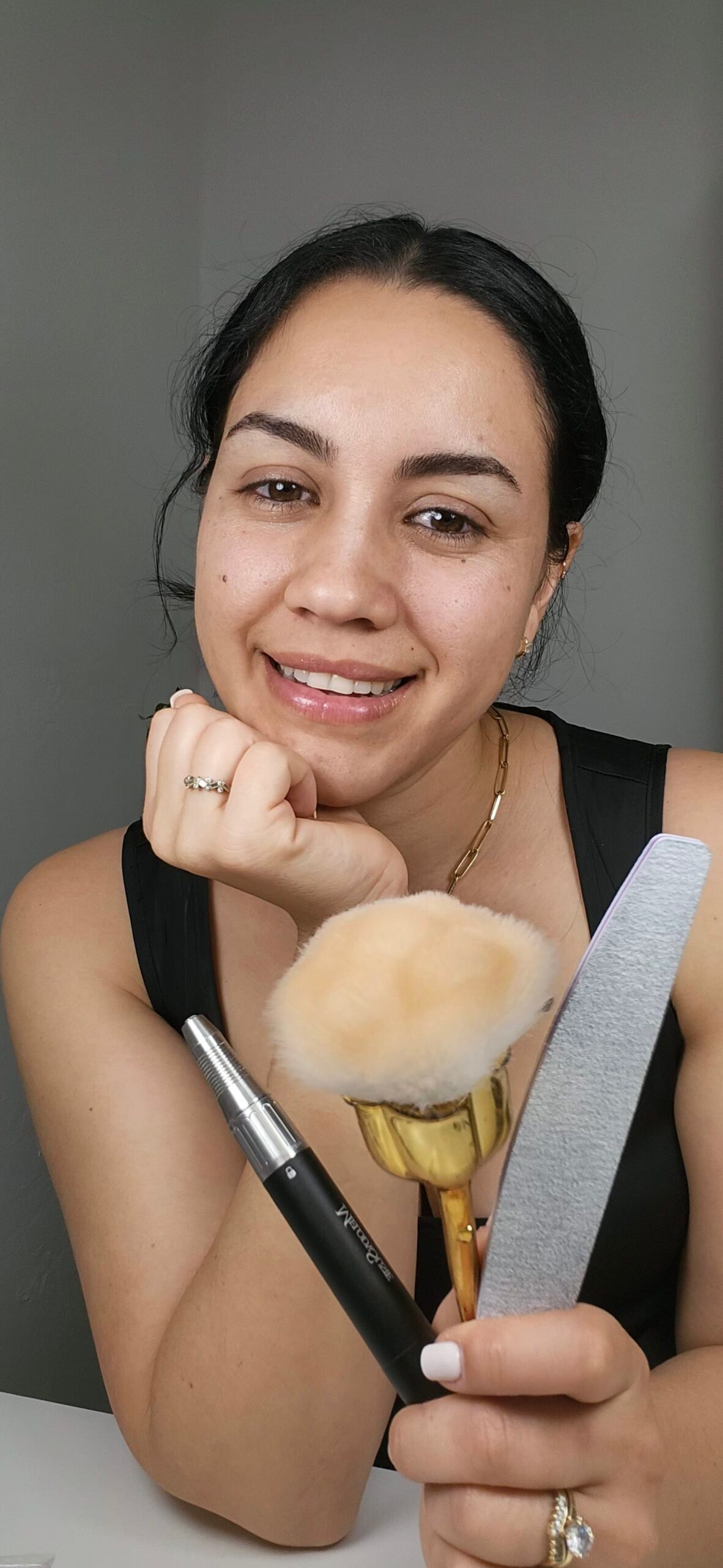 Odett performing a builder gel manicure in her Naples nail studio